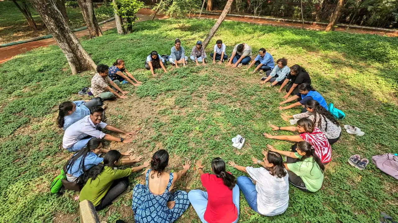 Participants in the 'Sacred Feminine' workshop at ArtSphere, engaging in deep, restorative practices to connect with their authentic selves.